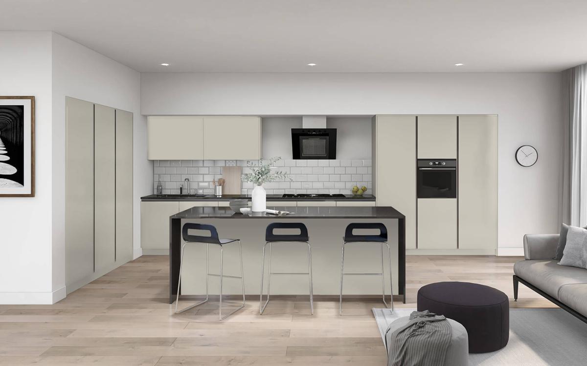 Lucca Pebble kitchen with feature island, black worktops, three stools, and tall bank of units with oven