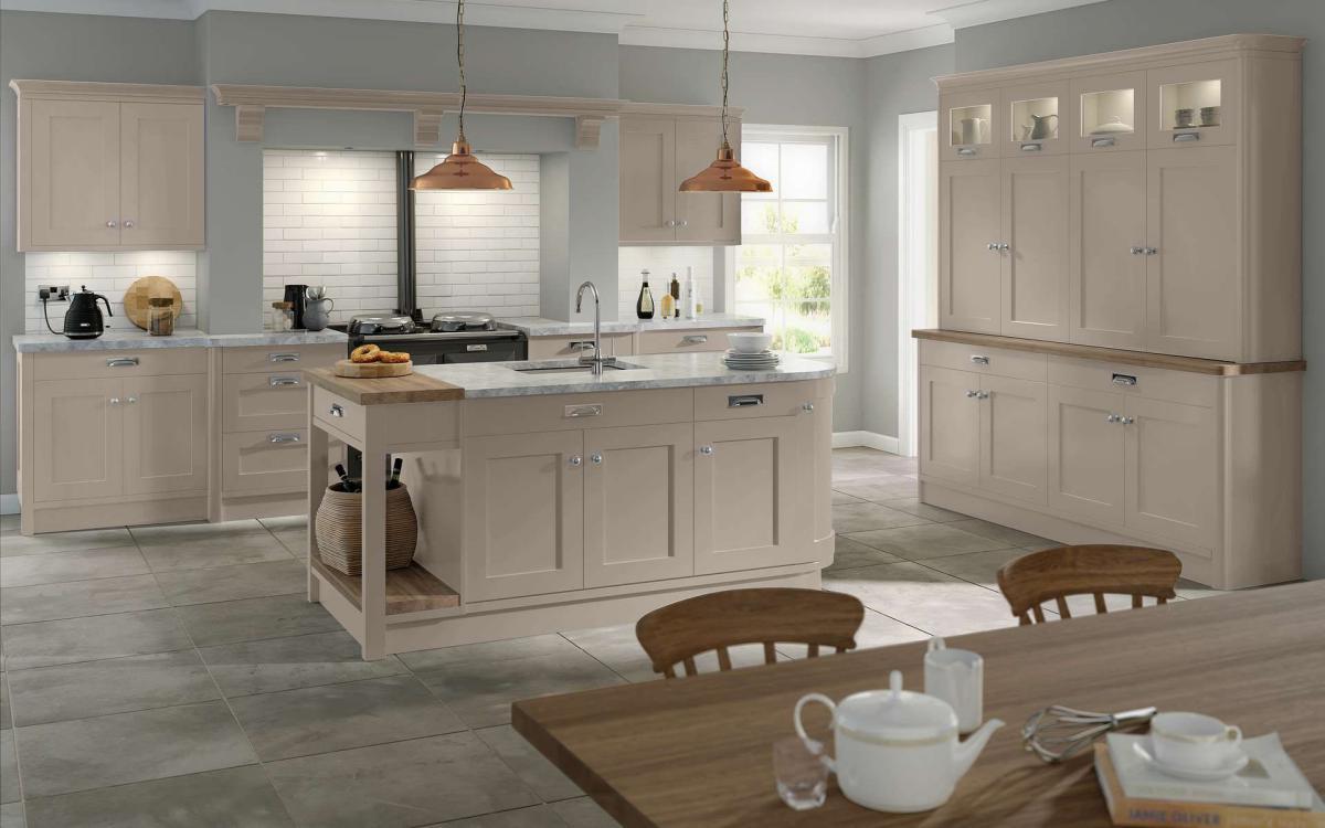 Country style kitchen with island, open fireplace, overmantle shelf, and large dresser in Bewdley Stone Grey style