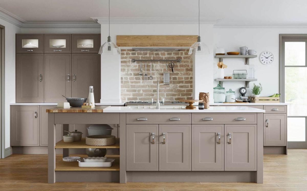 Shaker in-frame effect door style kitchen with island and pastry bench feature in Dewsbury Stone Grey style