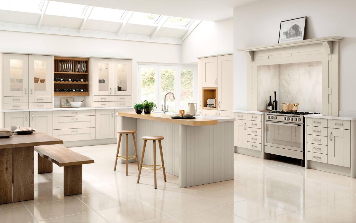 Light kitchen with island feature, thick timber worktop, and large feature dresser in Lynton Cashmere style