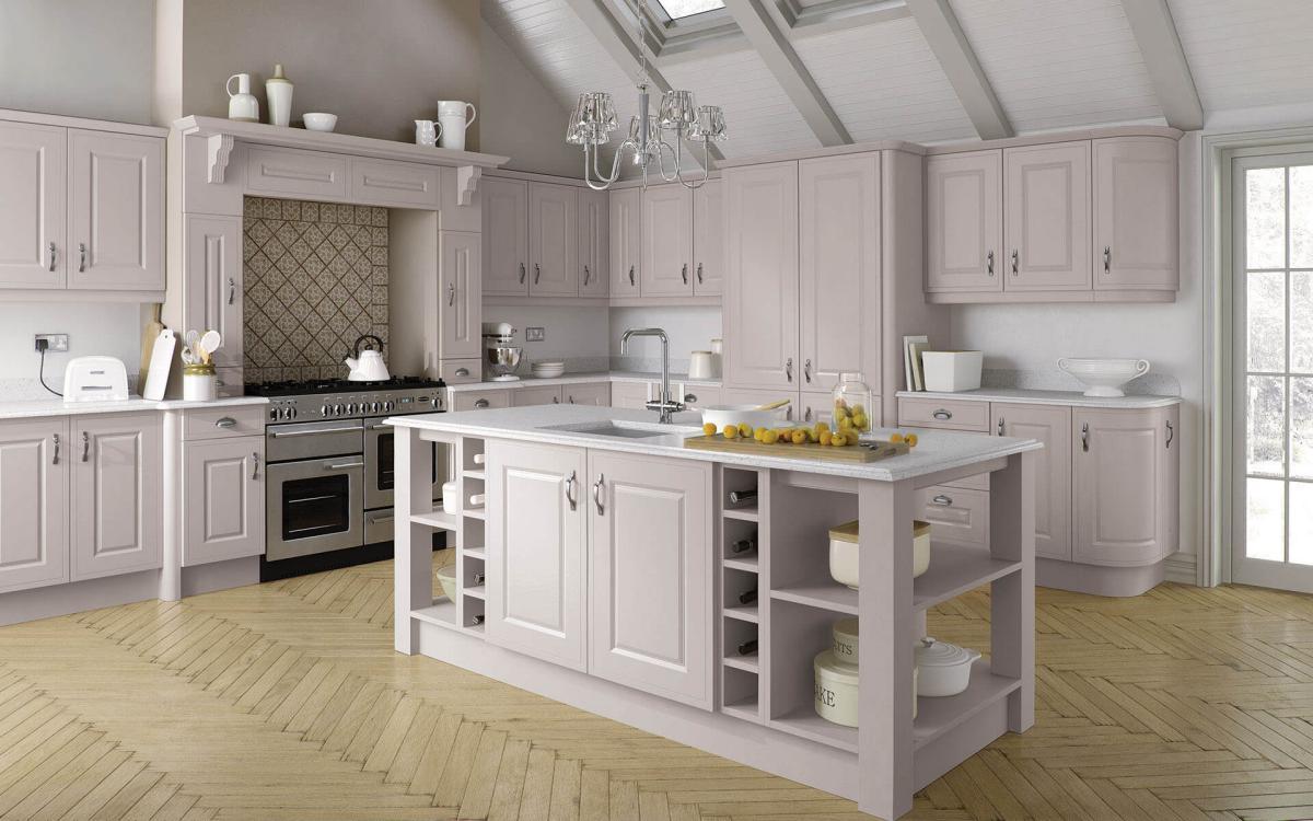 Large country kitchen with vaulted ceiling, chunky posts on island corners, and large overmantle feature in Helmsley Taupe style