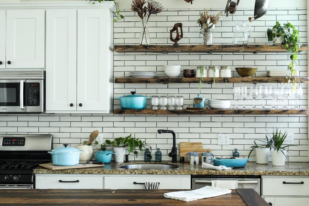 Subway tiled kitchen with rustic shelves