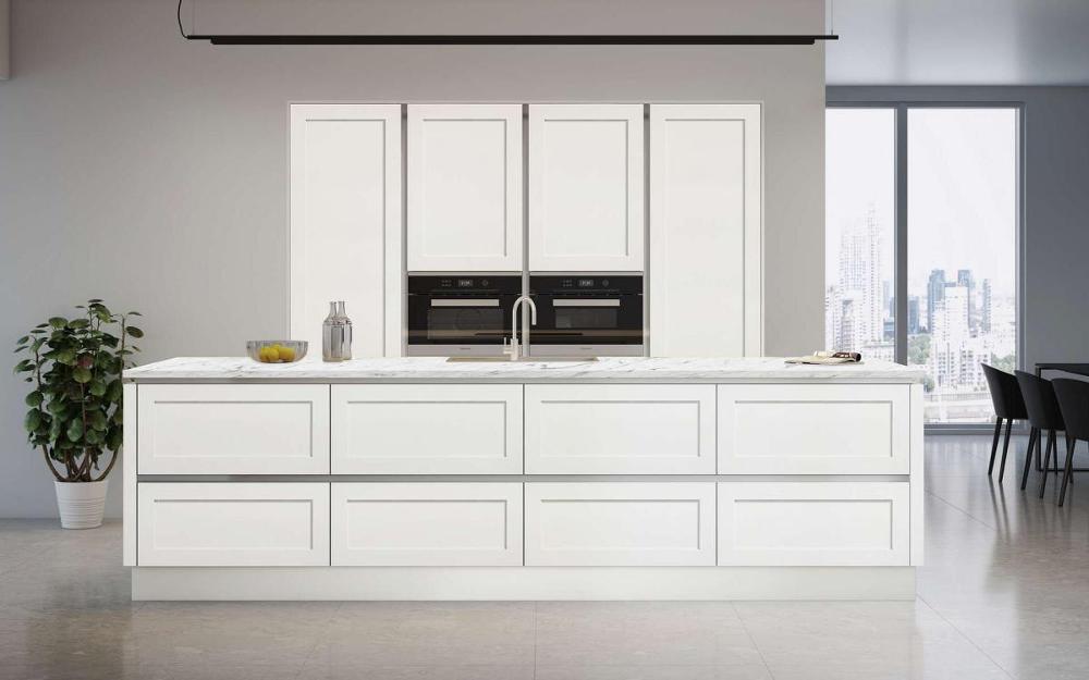 Open plan kitchen with island, white grey veined quartz worktops, recessed tall units in True Handleless Shaker Door Details Taupe style.