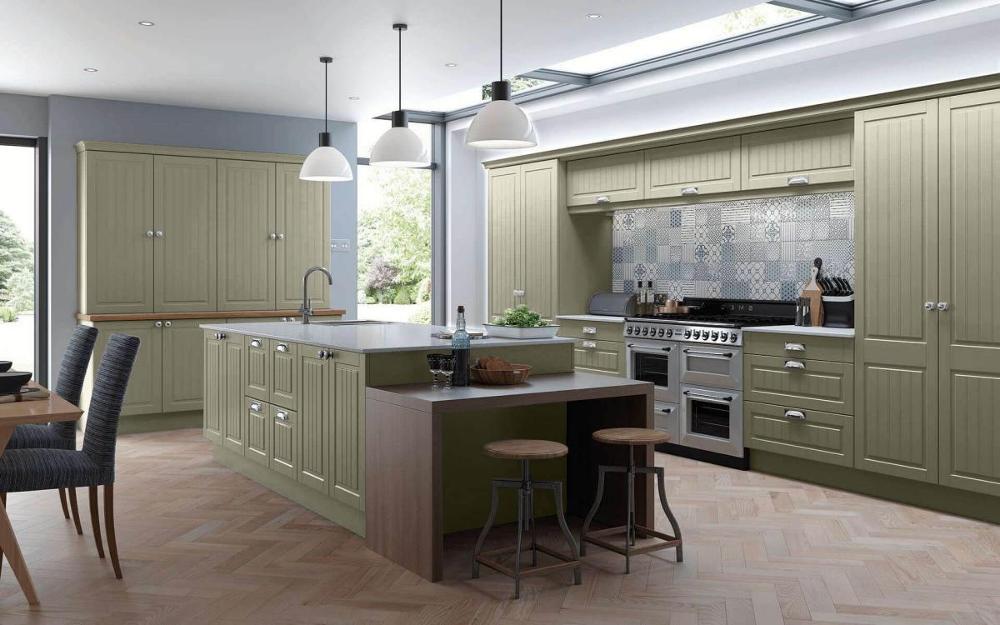 Tamar Reed Green Groove Panelled Kitchen with Feature Breakfast Table and two Low Height Stools.