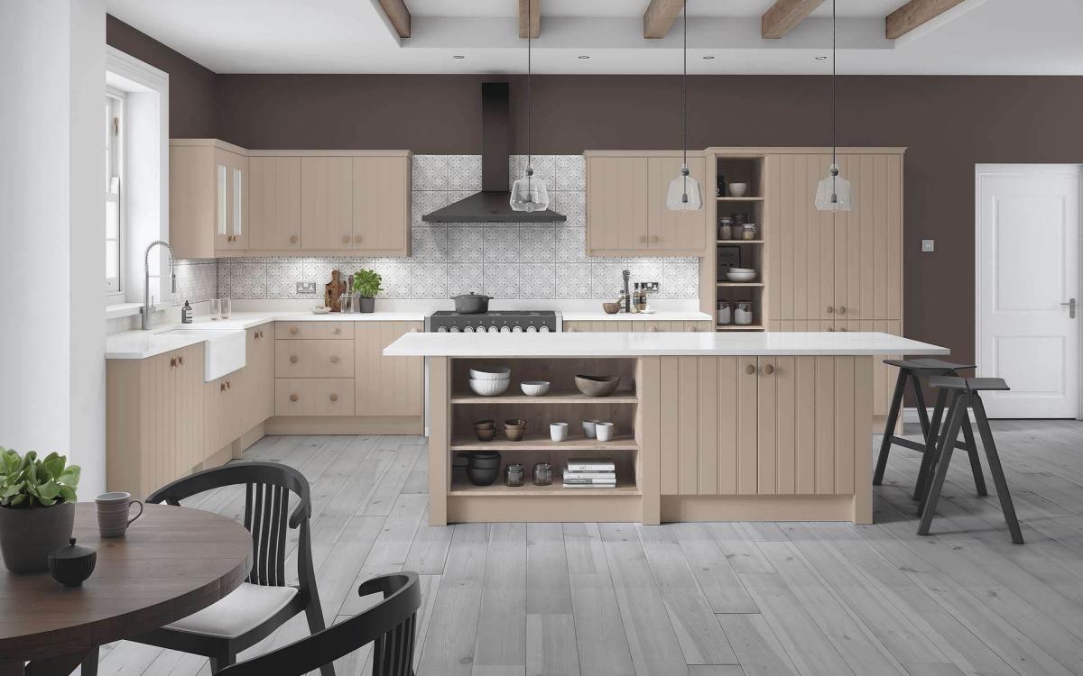 Open plan kitchen with island feature, geometric tiles, and white worktops in St Ives Stone Grey style