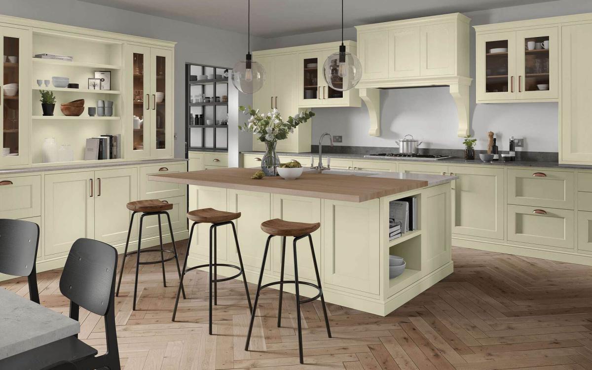 Kitchen with large island, two layered worktop, large glass window, and over hob canopy feature in Portwood Mussel style