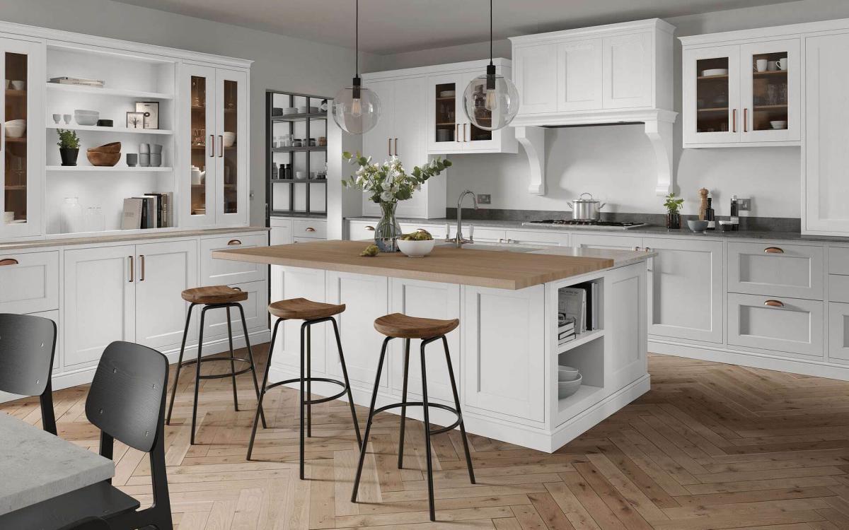 Kitchen with large island, two layered worktop, large glass window, and over hob canopy feature in Portwood Kashmir style