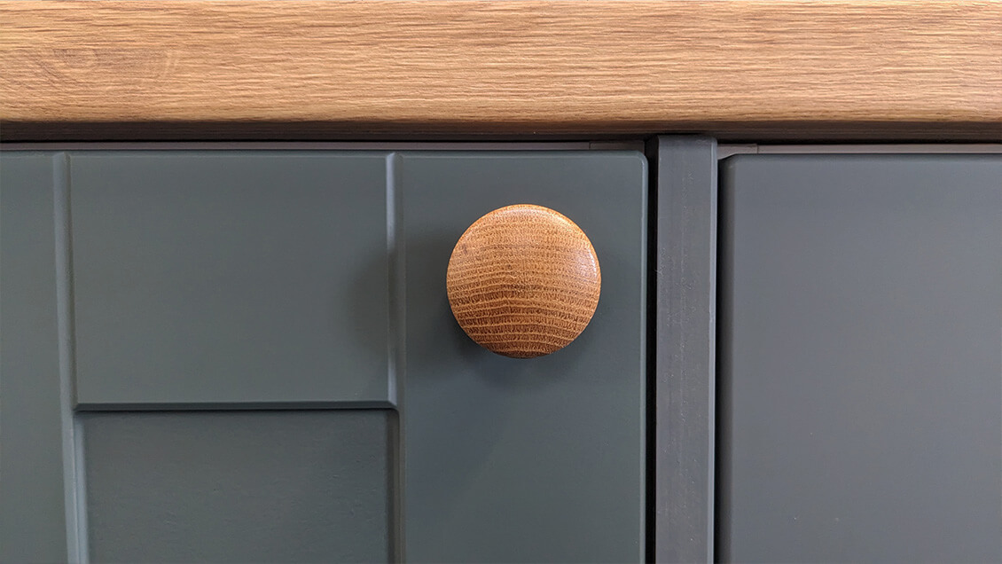  Sad frown on Wooden Oak Knob with down facing woodgrain direction Better Kitchens